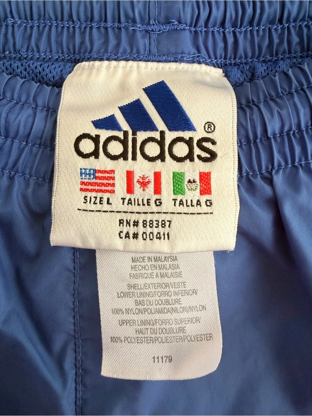 Vintage Adidas Windbreaker Blue Track Pants with Orange Side Stripes